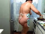 Chubby milf cooks pies and fucks with a wooden pestle in the kitchen. Her juicy PAWG and big tits are shaking. Homemade fetish. Does your wife make dinner naked?